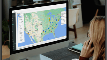 A lady looking at the EZTrack trailer tracking dashboard